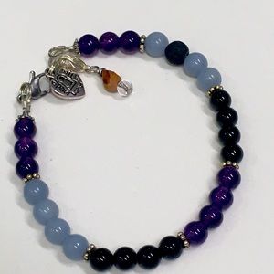 Stone bracelet new includes a silver heart ❤️ inscribed with “made with love”